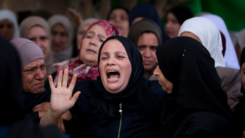 Palestinians bury woman killed in West Bank, 7 slain in Gaza