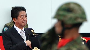 Abe renews pledge to change Japan's charter to boost troops