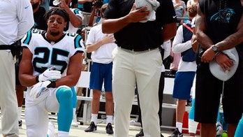 Eric Reid takes a knee during national anthem in first game as Carolina Panthers player