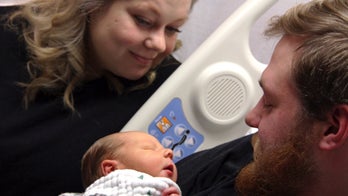 Woman saves husband who emerges from coma to see son's birth