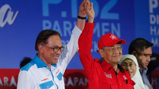 Malaysian PM rallies for successor and former foe Anwar