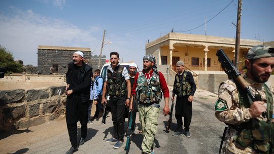 In Syria's Sweida, young men take up arms to defend villages