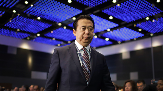 The Latest: Interpol aware officer is reported held in China