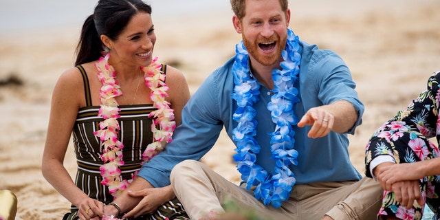Britain's Prince Harry and Meghan, Duchess of Sussex meet with a local surfing community group, known as OneWave, raising awareness for mental health and wellbeing in a fun and engaging way at Bondi Beach in Sydney, Australia, Friday, Oct. 19, 2018. Prince Harry and his wife Meghan are on day four of their 16-day tour of Australia and the South Pacific. — AP