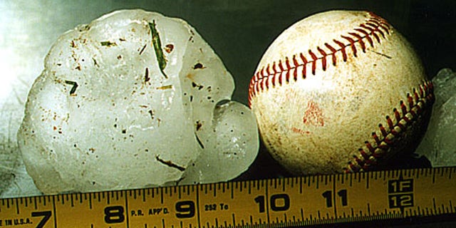 An Australian woman suffered severe bruises while protecting her baby from softball-sized hailstones on Thursday.