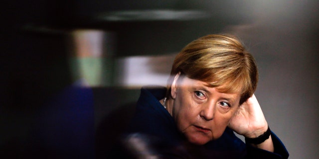 FILE - In this Oct. 17, 2018 file photo German Chancellor Angela Merkel attends a meeting of the German federal parliament, Bundestag, at the Reichstag building in Berlin. The stakes are unusually high for German Chancellor Angela Merkel’s government as the central region of Hesse votes in a state election this weekend. (AP Photo/Markus Schreiber, file)
