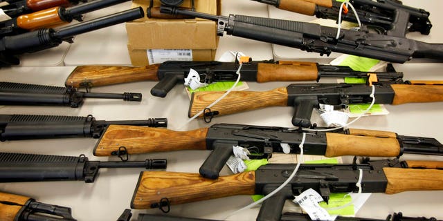 A cache of seized weapons that were to be smuggled into Mexico is displayed in Phoenix. Last week, a judge dismissed a $10 million lawsuit brought by Mexico against gun makers.