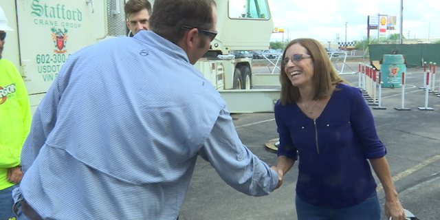 Rep. McSally touring a construction crane facility a week ahead of early voting.