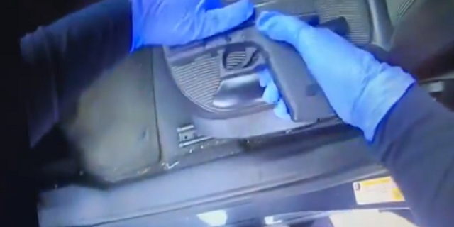 Police said they found a stolen gun beneath Madison's infant daughter.