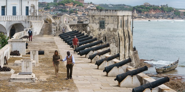 First lady Melania Trump tours Cape Coast Castle with museum educator Kwesi Essel-Blankson in Ghana on Oct. 3, 2018. The first lady is visiting Africa on her first solo international trip. (AP Photo/Carolyn Kaster)