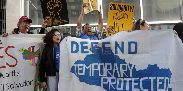 FILE: Supporters of temporary protected status immigrants before a news conference announcing a lawsuit against the Trump administration over its decision to end a program that lets immigrants live and work legally in the U.S.