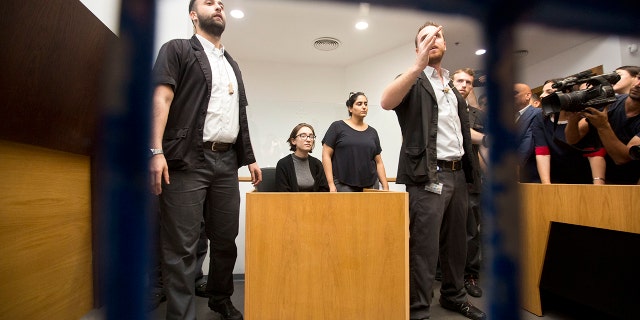 A senior Israeli cabinet minister on Wednesday defended the government's handling of the case of an American graduate student held in detention at the country's international airport for the past week over allegations that she promotes a boycott against the Jewish state. (AP Photo/Sebastian Scheiner)