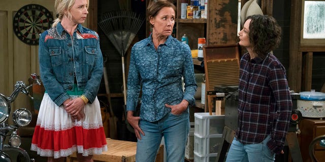 This image released by ABC shows Lecy Goranson, from left, Laurie Metcalf and Sara Gilbert in a scene from "The Conners," airing Tuesdays on ABC. (Eric McCandless/ABC via AP)
