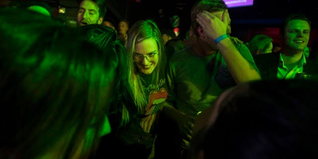 People celebrate at Leafly's countdown party as midnight passes and marks the first day of the legalization of cannabis across Canada in Toronto on Wednesday