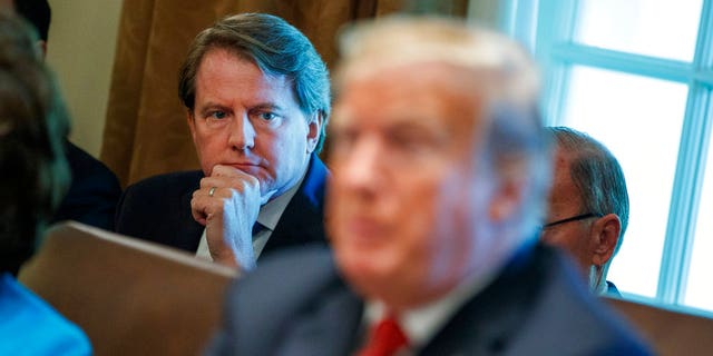 White House counsel Don McGahn looks on as President Donald Trump speaks during a cabinet meeting in the Cabinet Room of the White House, Wednesday, Oct. 17, 2018, in Washington. (AP Photo/Evan Vucci)
