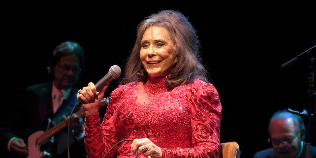 In this Aug. 28, 2016 file photo, Loretta Lynn performs in concert at the American Music Theater in Lancaster, Pa. Lynn says she is doing better after a brief hospital visit to treat an illness that kept her from attending a CMT tribute to her and other female country artists.