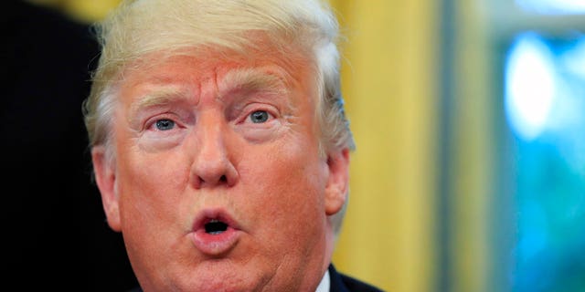 FILE: President Donald Trump speaking to reporters at the White House.