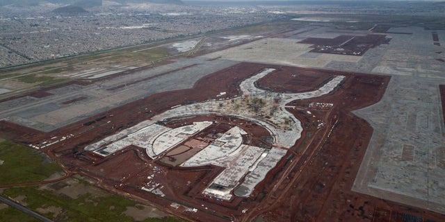 This Oct. 17, 2018 photo, a shows the construction of new airport in Texcoco, Mexico. The future of Mexico City's new airport, already about a third completed, comes down to a public vote this week in a political high-wire act by the country's president-elect that could shut down Mexico's largest infrastructure project in recent memory. (AP Photo/Miguel Tovar)