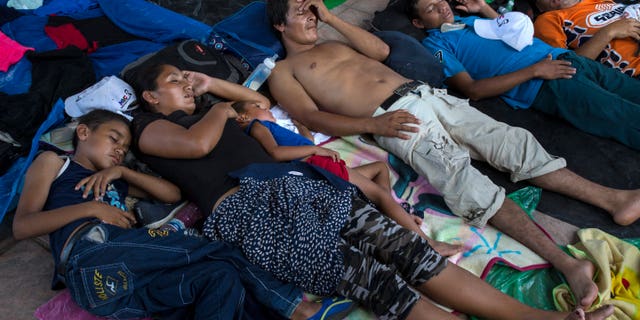 Honduran migrants rest in Pijijiapan, Mexico, Thursday, Oct. 25, 2018. Thousands of Central American migrants have renewed their hoped-for march to the United States on Wednesday. (AP Photo/Rodrigo Abd)