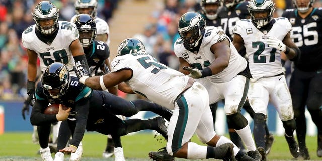 FILE: Jacksonville Jaguars quarterback Blake Bortles dives to make a down during the second half of an NFL football game against Philadelphia Eagles at Wembley stadium in London.