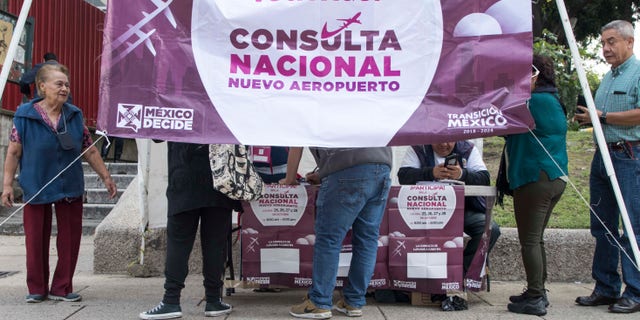 People vote on whether to continue with the $13 billion airport to replace the current Benito Juarez International Airport, in Mexico City, Sunday, Oct. 28, 2018. The future of Mexico City's new airport, already about a third completed, comes down to a public vote this week in a political high-wire act by the country's president-elect that could shut down Mexico's largest infrastructure project in recent memory. Lopez Obrador promised to let the people decide the fate of the airport. (AP Photo/Christian Palma)