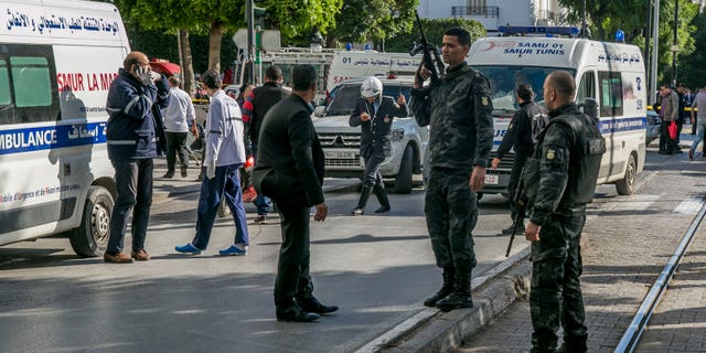 Tunisian police officers secure the site of an attack after a 30-year-old woman blew herself on the Habib Bourguiba avenue in Tunis, Tunisia. (AP Photo/Riadh Dridi)