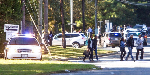 A student shot and killed a fellow classmate during a fight in a crowded school hallway Monday, officials said, prompting a lockdown and generating an atmosphere of chaos and fear as dozens of parents rushed to the school to make sure their children were safe.