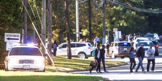 A student shot and killed a fellow classmate during a fight in a crowded school hallway Monday, officials said, prompting a lockdown and generating an atmosphere of chaos and fear as dozens of parents rushed to the school to make sure their children were safe.