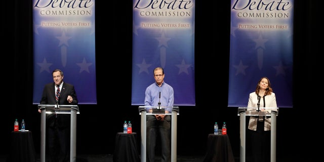Democratic Sen. Joe Donnelly, Republican former state Rep. Mike Braun and Libertarian Lucy Brenton, from left, participate in a U.S. Senate debate. The Indiana Democratic Party sent a mailer to voters last week comparing Brenton to Braun, saying she is the better choice for those who want lower taxes.