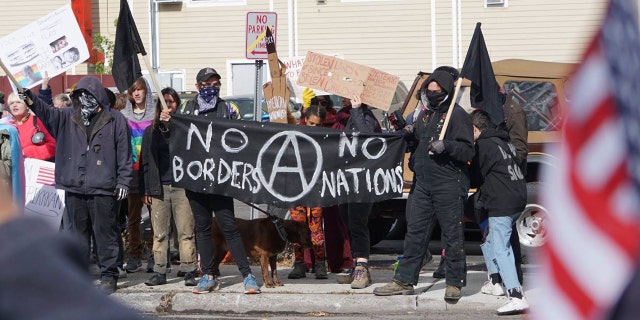 A group of 20 or so protesters gathered Sunday on the opposite sidewalk of the "American flag appreciation walk" in New Paltz, New York.