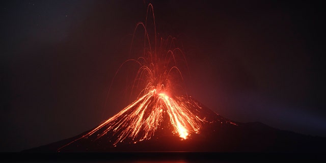 Lava streams down from Anak Krakatau (Child of Krakatoa) volcano during an eruption as seen from Rakata island in South Lampung on July 19, 2018 - file photo.