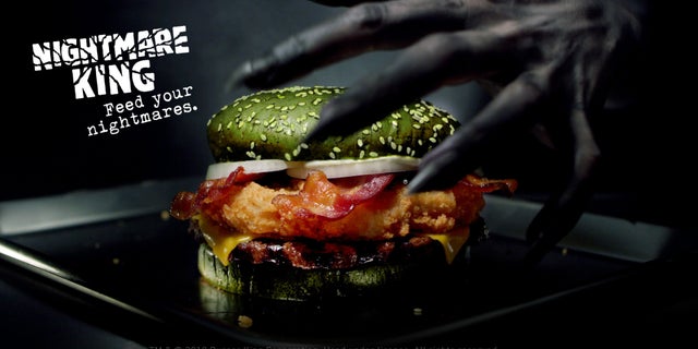 Burger King is releasing a green burger stuffed with chicken, beef and bacon just in time for Halloween.