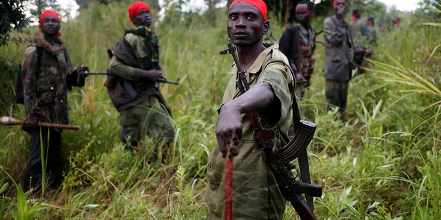 SPLA-IO (SPLA-In Opposition) rebels stand after an assault on government SPLA (Sudan People's Liberation Army) soldiers, outside the town of Kaya, on the border with Uganda, South Sudan, August 26, 2017. REUTERS/Goran Tomasevic