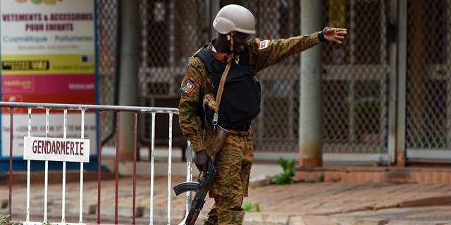 A security official gestures as he stands at a barrier close to the site of a terrorist attack in Ouagadougou on August 15, 2017.  (KAMBOU/AFP/Getty Images)