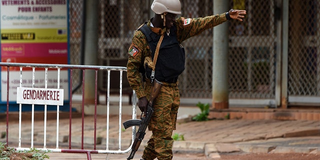 A security official gestures as he stands at a barrier close to the site of a terrorist attack in Ouagadougou on August 15, 2017. (KAMBOU/AFP/Getty Images)