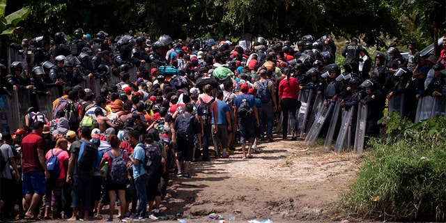 The group of Central American migrants were met by Mexican Federal Police. (AP Photo/Santiago Billy)