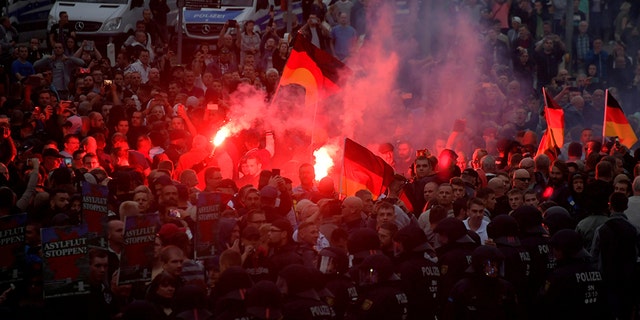 Right-wing supporters protest after a German man was stabbed last weekend in Chemnitz, Germany, August 27