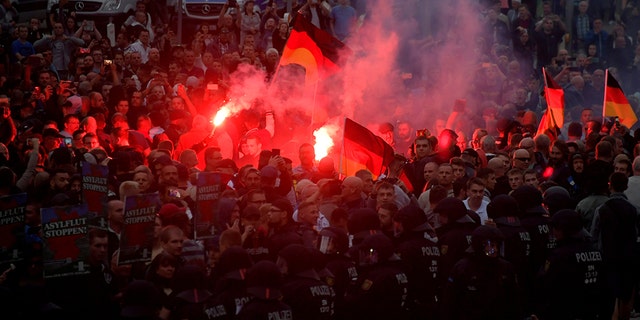 Right-wing supporters protest after a German man was stabbed last weekend in Chemnitz, Germany, August 27