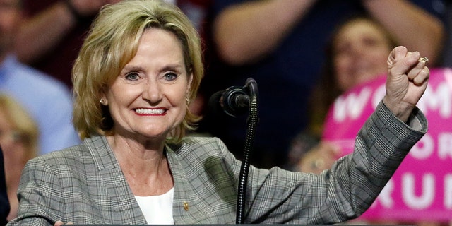 FILE - In this Oct. 2, 2018 photograph, U.S. Sen. Cindy Hyde-Smith, R-Miss., encourages the crowd at a rally in Southaven, Miss. (AP Photo/Rogelio V. Solis, File)