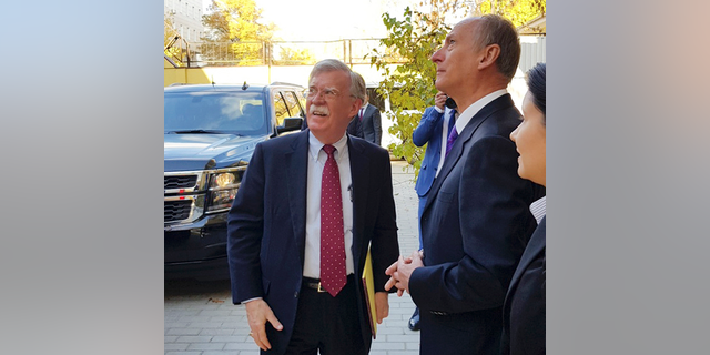 U.S. National Security Adviser John Bolton, left, and Russian Security Council chairman Nikolai Patrushev talk prior their official talks in Moscow, Russia, Monday, Oct. 22, 2018. Bolton met with Patrushev to discuss a broad range of issues including arms control agreements, Syria, Iran, North Korea and the fight against terrorism.(Press Service of the Russian Security Council via AP)