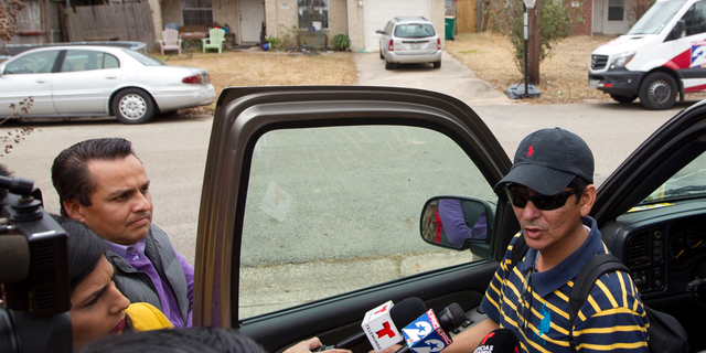 CHANGES NAME TO VALLADARES - Ernesto Valladares, brother of Ulises Valladares, speaks to the media Friday, Oct. 26, 2018 across from his brother's home where Ulises and his son were bound by a pair of men on Wednesday. The father was taken away by the kidnappers and later killed during an FBI raid Thursday morning. (Jason Fochtman/Houston Chronicle via AP, File)