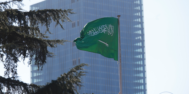 Saudi Arabia's flag flies atop the country's consulate in Istanbul, Friday, Oct. 26, 2018. The Saudi officials who killed journalist Jamal Khashoggi in their Istanbul consulate must reveal the location of his body, Turkey's President Recep Tayyip Erdogan said Friday in remarks that were sharply critical of the kingdom's handling of the case.(AP Photo/Lefteris Pitarakis)