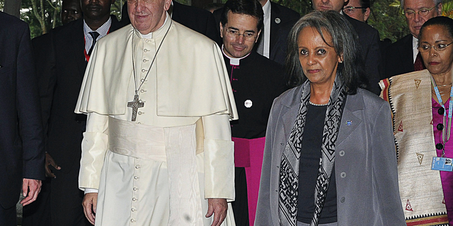 FILE - In this Thursday, Nov. 26, 2015 file photo, Pope Francis walks next to then Director-General of the United Nations Office at Nairobi (UNON) Sahle-Work Zewde, right, upon his arrival there in Nairobi, Kenya. Ethiopian lawmakers unanimously elected the seasoned diplomat Sahle-Work Zewde as the country's first female president, a largely ceremonial post, on Thursday, Oct. 25, 2018. (Simon Maina/Pool via AP, File)