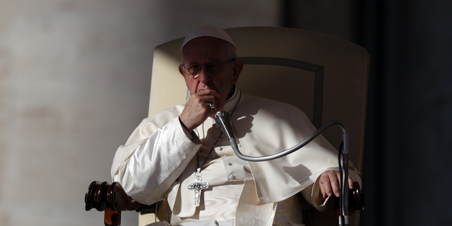 Pope Francis listens to the welcome speeches during his weekly general audience in St. Peter's Square at the Vatican, Wednesday, Oct. 24, 2018. (AP Photo/Gregorio Borgia)