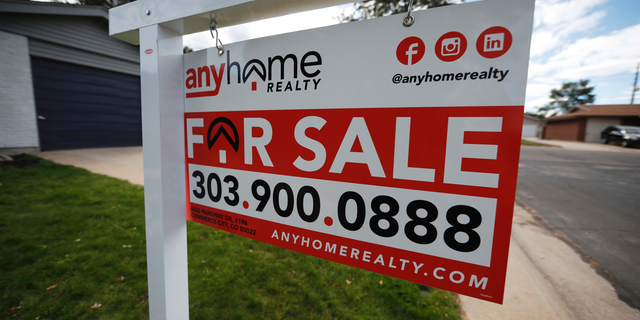 FILE- In this Oct 2, 2018, photo a for sale sign stands outside a home on the market in the north Denver suburb of Thornton, Colo. On Tuesday, Oct. 30, the Standard & Poor's/Case-Shiller 20-city home price index for August is released. (AP Photo/David Zalubowski, File)