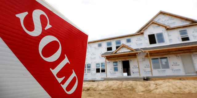 FILE- In this June 27, 2018, file photo, a sold sign stands in front of a home under construction in West Des Moines, Iowa. On Wednesday, Oct. 24, the Commerce Department reports on sales of new homes in September. (AP Photo/Charlie Neibergall, File)