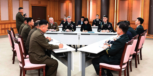FILE - In this Oct. 16, 2018, file photo provided by South Korea Defense Ministry, the U.S.-led United Nations Command, center, South Korean and North Korean, left, military officers attend a meeting at the southern side of Panmunjom in the Demilitarized Zone, South Korea. The two Koreas and the U.S.-led U.N. Command on Monday, Oct. 22, 2018, are meeting again at the Koreas' border village to examine an ongoing effort to disarm the area. (South Korea Defense Ministry via AP, File)
