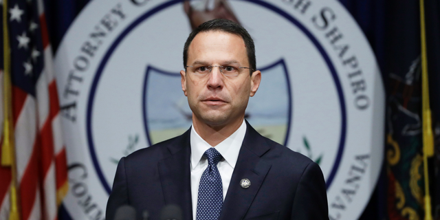 FILE - In this Aug. 14, 2018, file photo, Pennsylvania Attorney General Josh Shapiro speaks about a grand jury’s report on clergy abuse in the Roman Catholic Church during a news conference at the Capitol in Harrisburg, Pa. The U.S. Justice Department opened their own investigation and have served subpoenas on dioceses across the state, according to multiple sources who spoke to The Associated Press on condition of anonymity. The subpoenas follow the state grand jury report. (AP Photo/Matt Rourke, File)