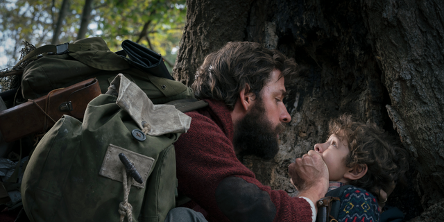 This image released by Paramount Pictures shows John Krasinski (L) and Noah Jupe (R) in a scene from 'A Quiet Place.'