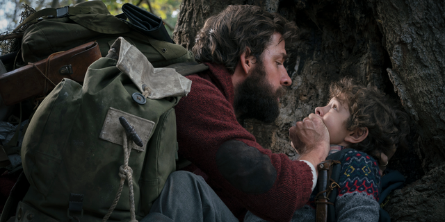John Krasinski, left, and Noah Jupe are seen in a scene from "A Quiet Place."